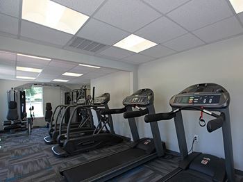 fitness center area with treadmills